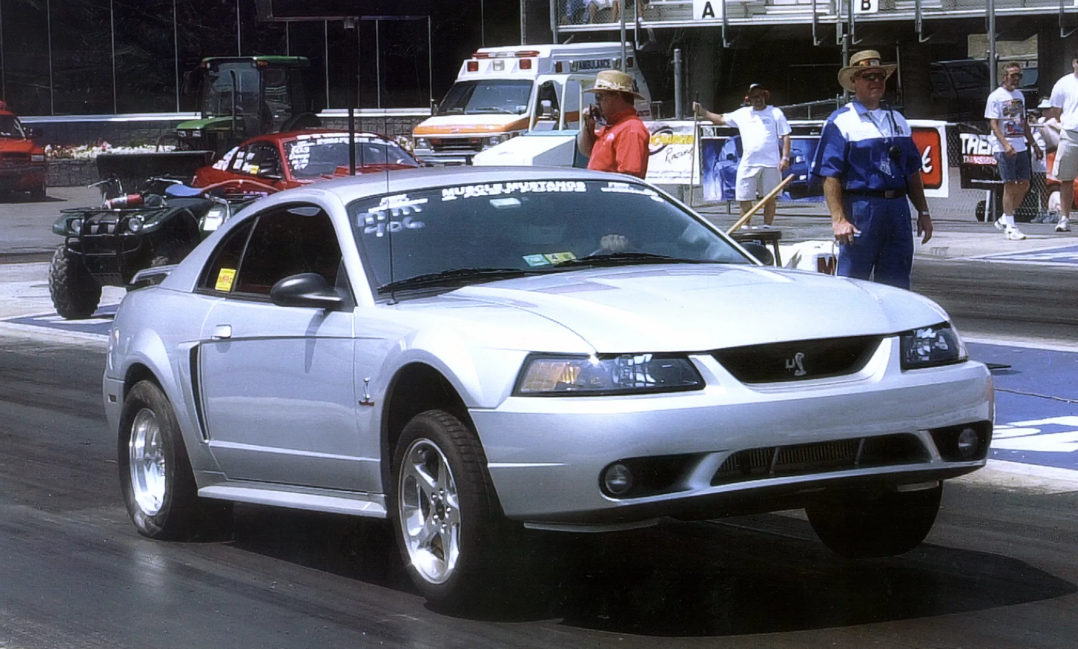 ProCharged silver Ford Mustang Cobra racing