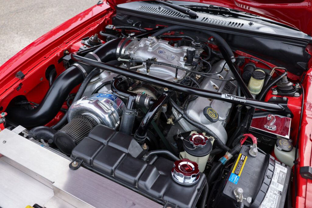 Red procharged ford mustang engine bay