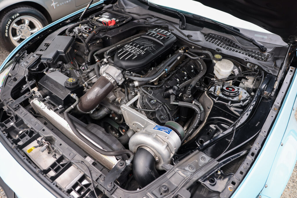 blue wide body procharged mustang engine bay