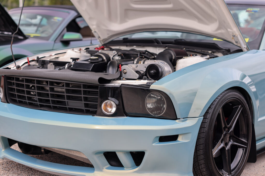 baby blue procharged mustang engine bay