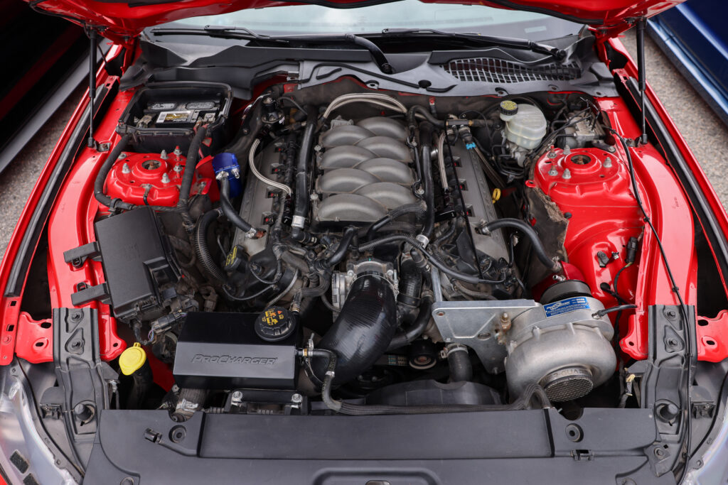 Red S550 ProCharged Mustang engine bay