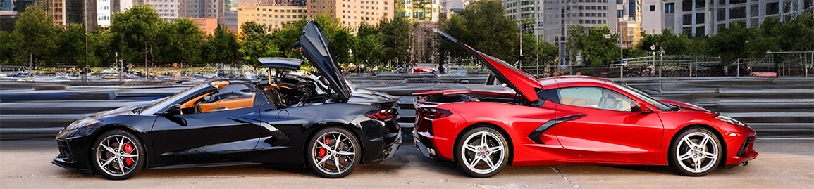 Supercharged Corvette C8 HTC and Coupe with cityscape background