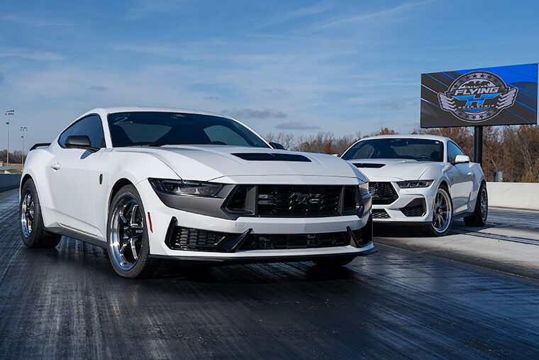 Two S650 Mustangs Pose for a Photo on a Drag Strip