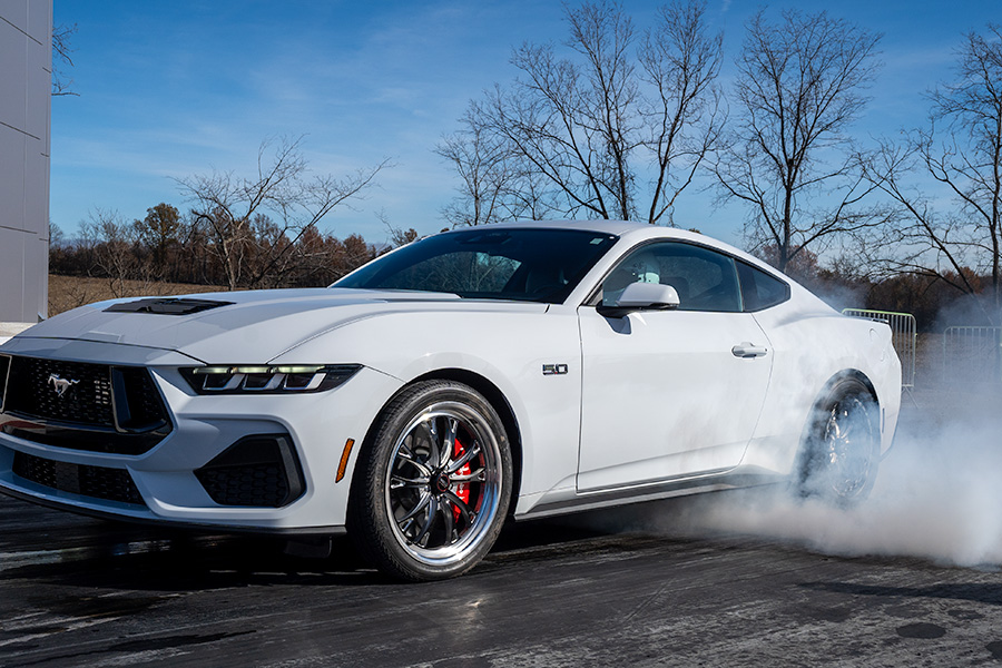 White S650 Mustang does a Burnout at a Drag Strip