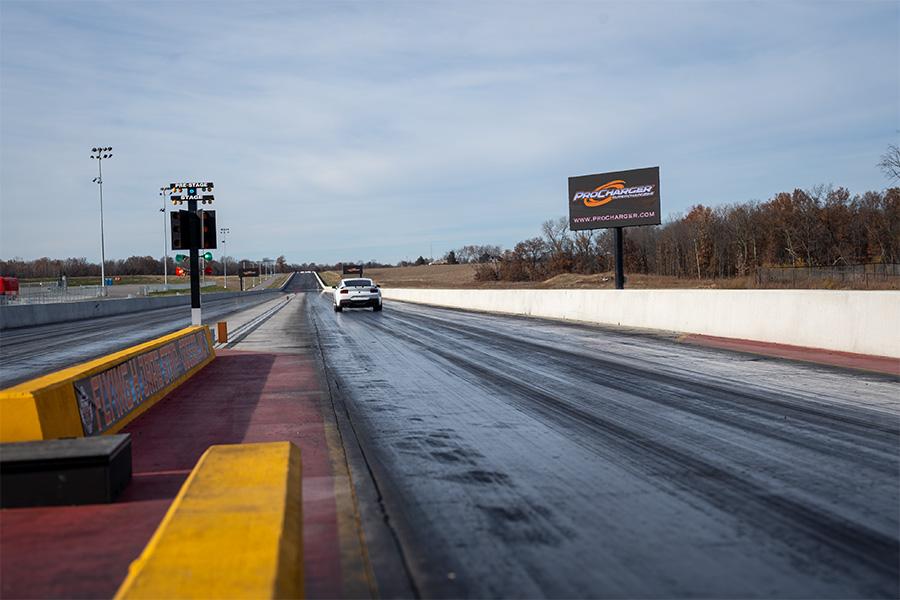 S650 Mustang Runs the Quarter Mile with ProCharger Sign in the Background